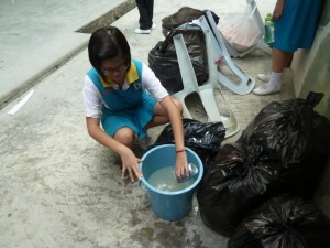 One of the member was washing the aluminium can before recycling.